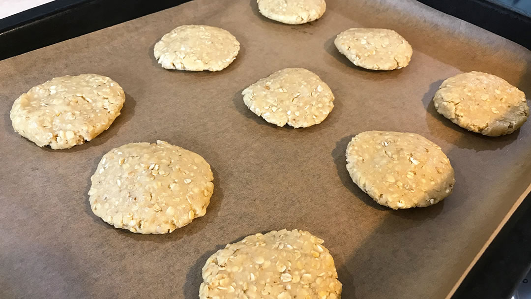 Porridge oat biscuits on a baking tray