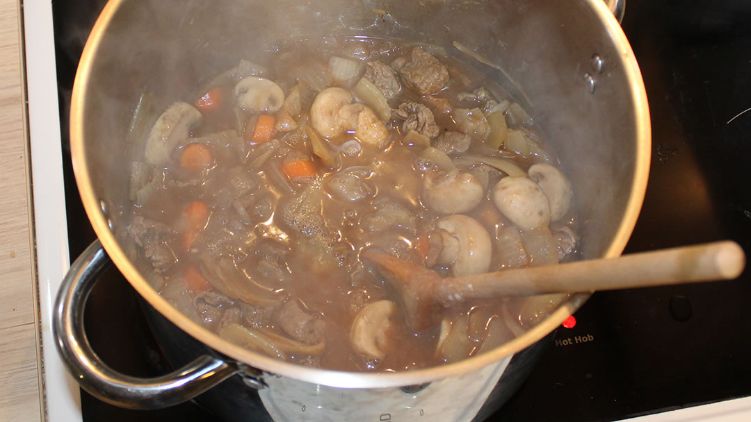 Stew after adding the stock and beer