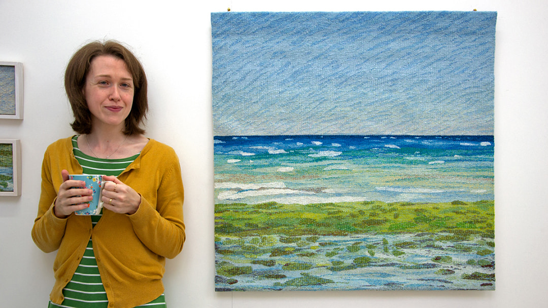 Jo with her handwoven tapestry 'Inganess Ebb'