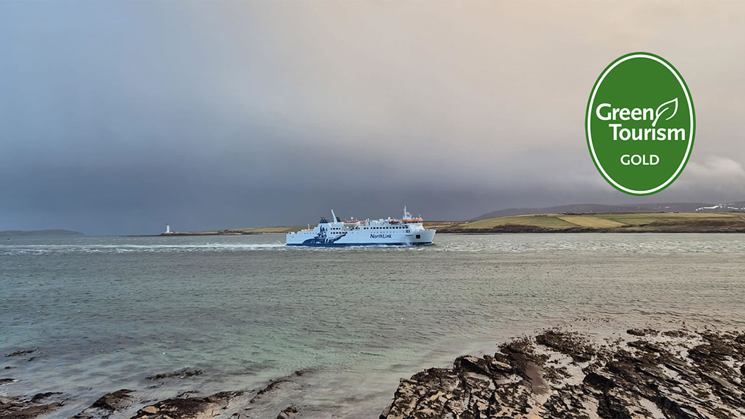 MV Hamnavoe sailing from the Orkney Islands in winter gold