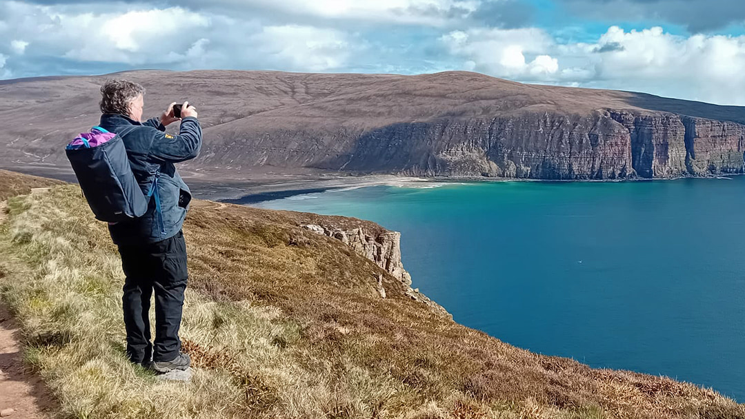 Steve admiring the view over Rackwick Bay and the coastline of Hoy
