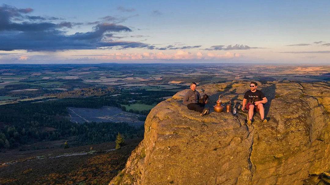 Chris and Andrew distilling gin on top of Bennachie