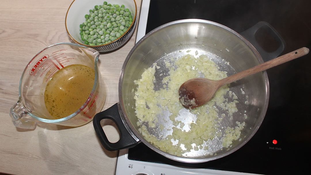 Frying the onion and garlic for the pea soup