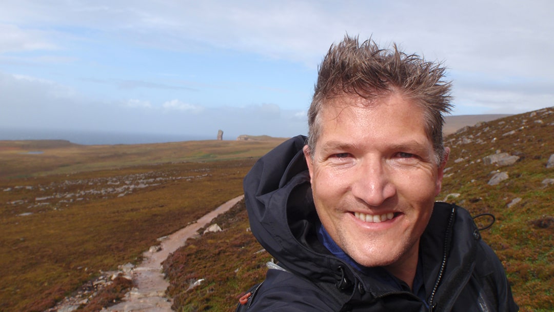 Robin walking to the Old Man of Hoy