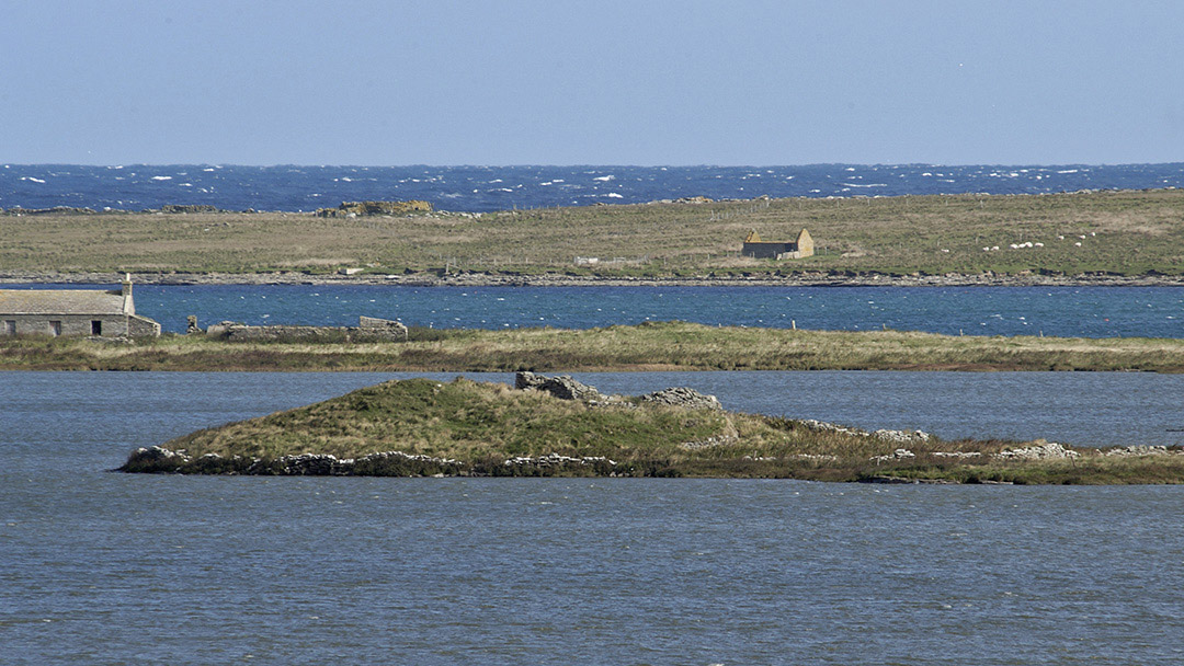 The ruins of St Tredwell's Church and the surrounding loch in Papay