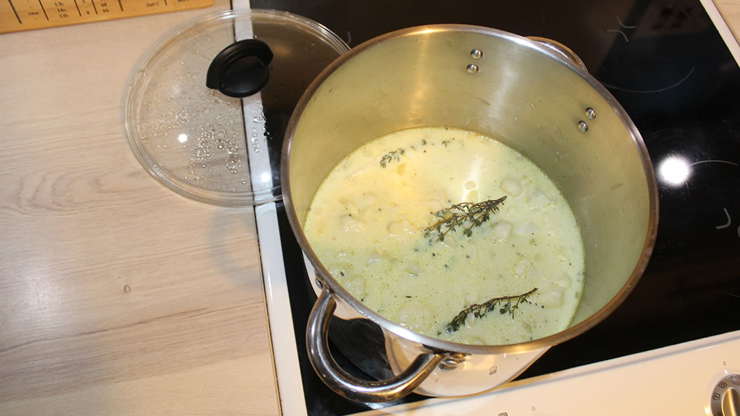 After the potatoes, stock and milk have been added