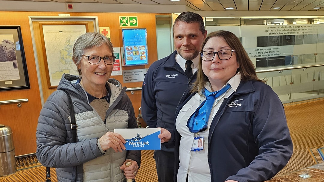 200,000th passenger, Elizabeth Flett, with Gary Watt (Master) and Karen Riddell (Purser) on the MV Hamnavoe