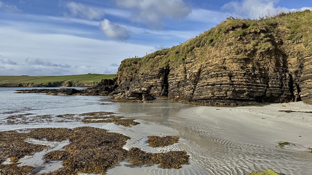 Cliffs surrounding a beach in Sanday, Orkney