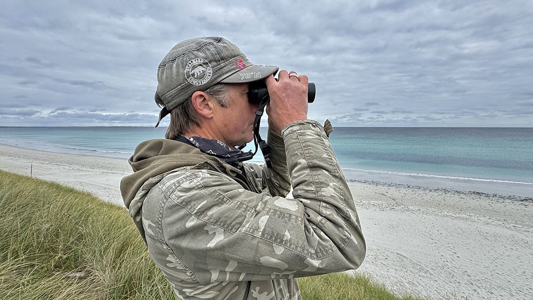 Russel Neave overlooking a beach in Sanday, Orkney