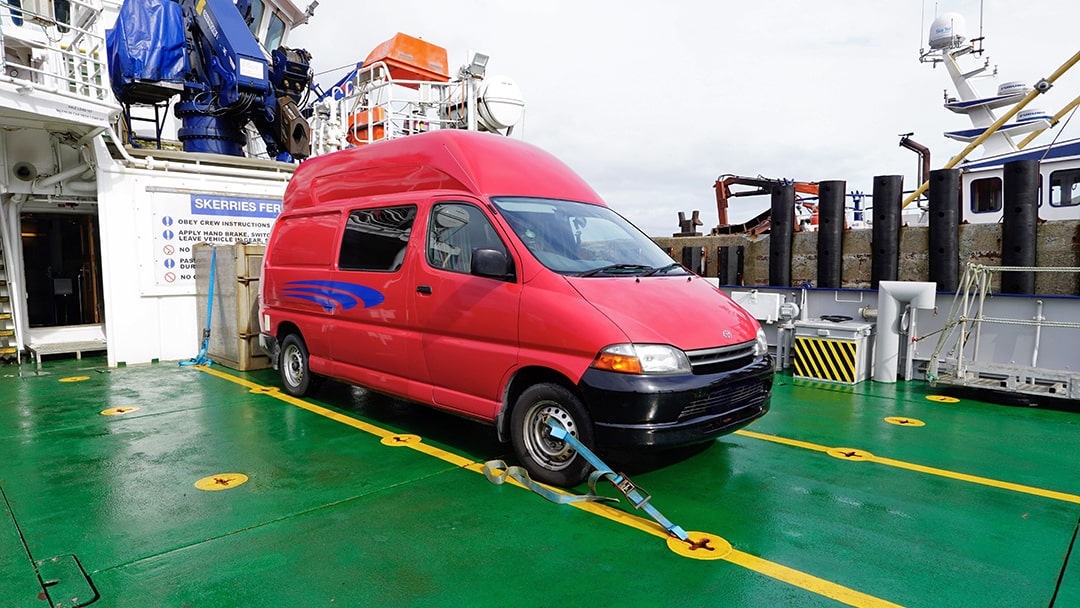 Ruth's campervan tied down onboard for the journey home