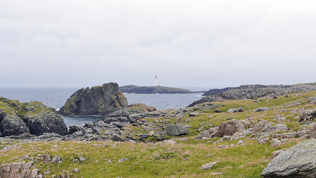 The Bound Skerry Lighthouse standing tall against the rugged landscape