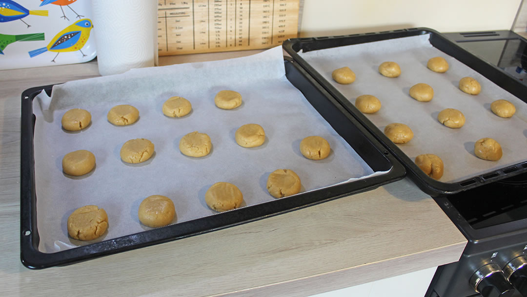 The mixture, rolled into balls on two baking trays