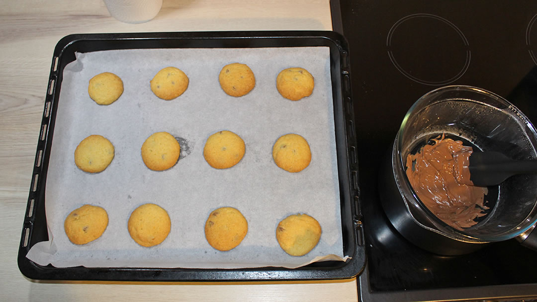 Orange biscuits and melted chocolate for decoration