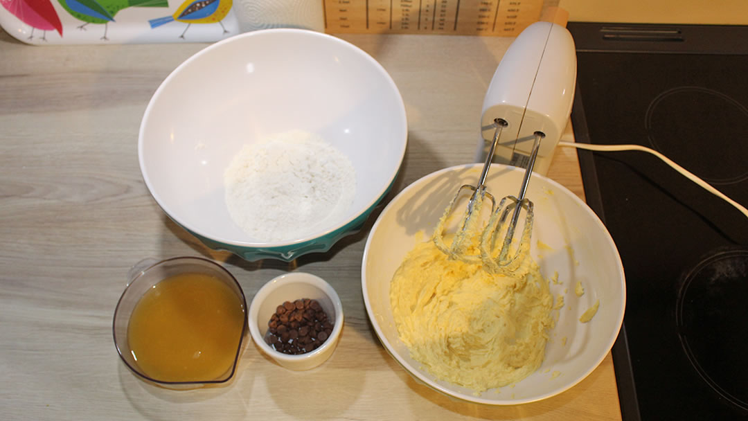 The creamed marg, sugar and rind, along with flour, chocolate chips and orange juice ready to mix together